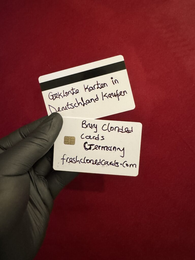 Two clone cards ready for ATM use held in hand for sale in Germany – high limit cloned credit cards for Berlin, Munich, Frankfurt, and all cities