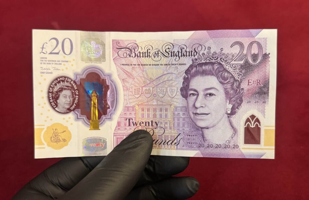 Front side of our fake £20 pound note showing portrait of Adam Smith and realistic counterfeit GBP security features